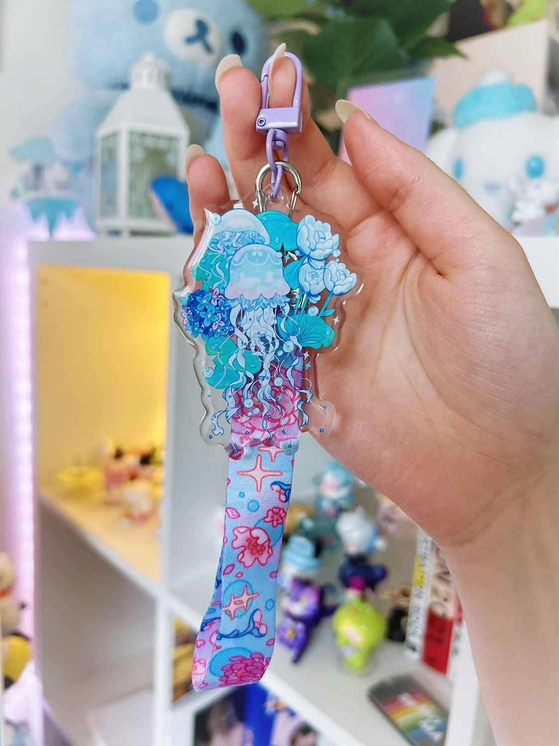 An acrylic lanyard keychain featuring a Jellyfish Garden concept