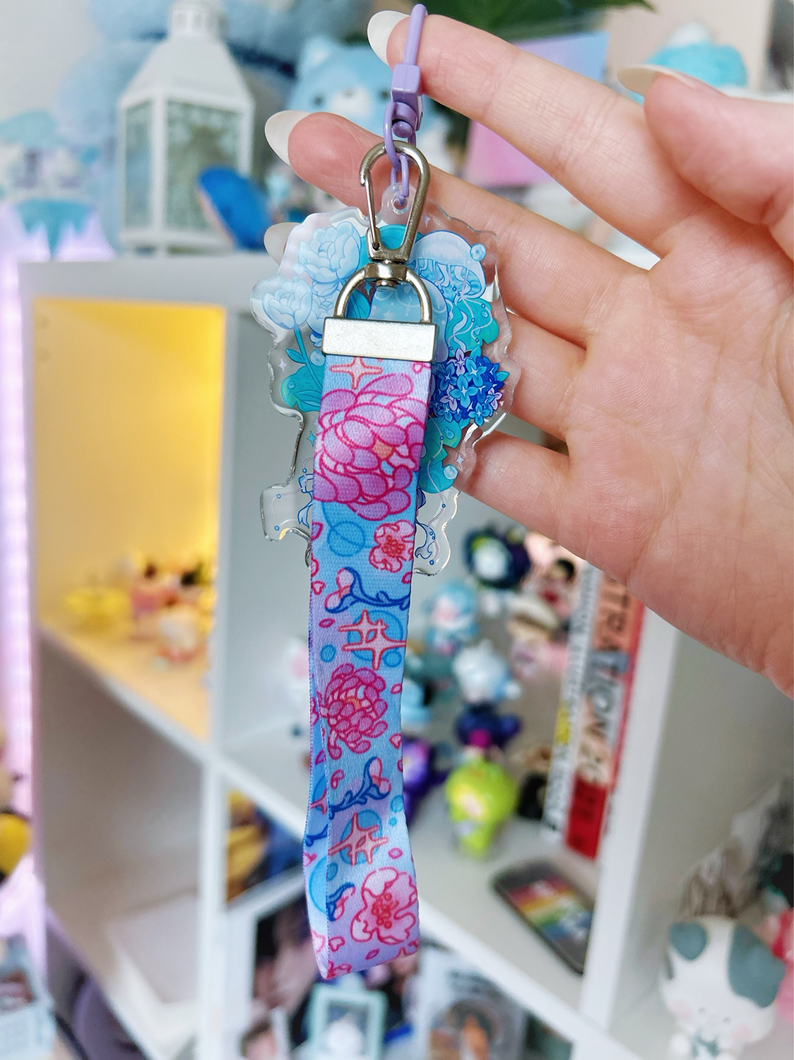 An acrylic lanyard keychain featuring a Jellyfish Garden concept