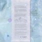 A printed love letter card with decorative border and cursive writing, displayed on a textured light blue fabric background with scattered star and swirl stickers. The card includes a short story, small animal illustrations, and a message from the sea milk. mail club.