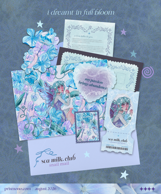 A flat lay of pastel blue and lavender craft paper embellishments, stickers, and a small printed card arranged on a textured blue-gray background for a snail mail club. The designs feature whimsical fairy and floral hydrangea illustrations, with text including 'i dreamt in full bloom' and 'sea milk.'