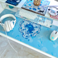Decorative heart-shaped cupid swan themed mousepad desk mat for cute gaming set-ups and coquette blue and white theme.