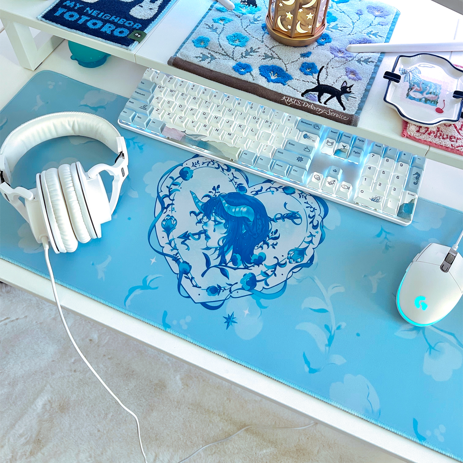 Decorative heart-shaped cupid swan themed mousepad desk mat for cute gaming set-ups and coquette blue and white theme.