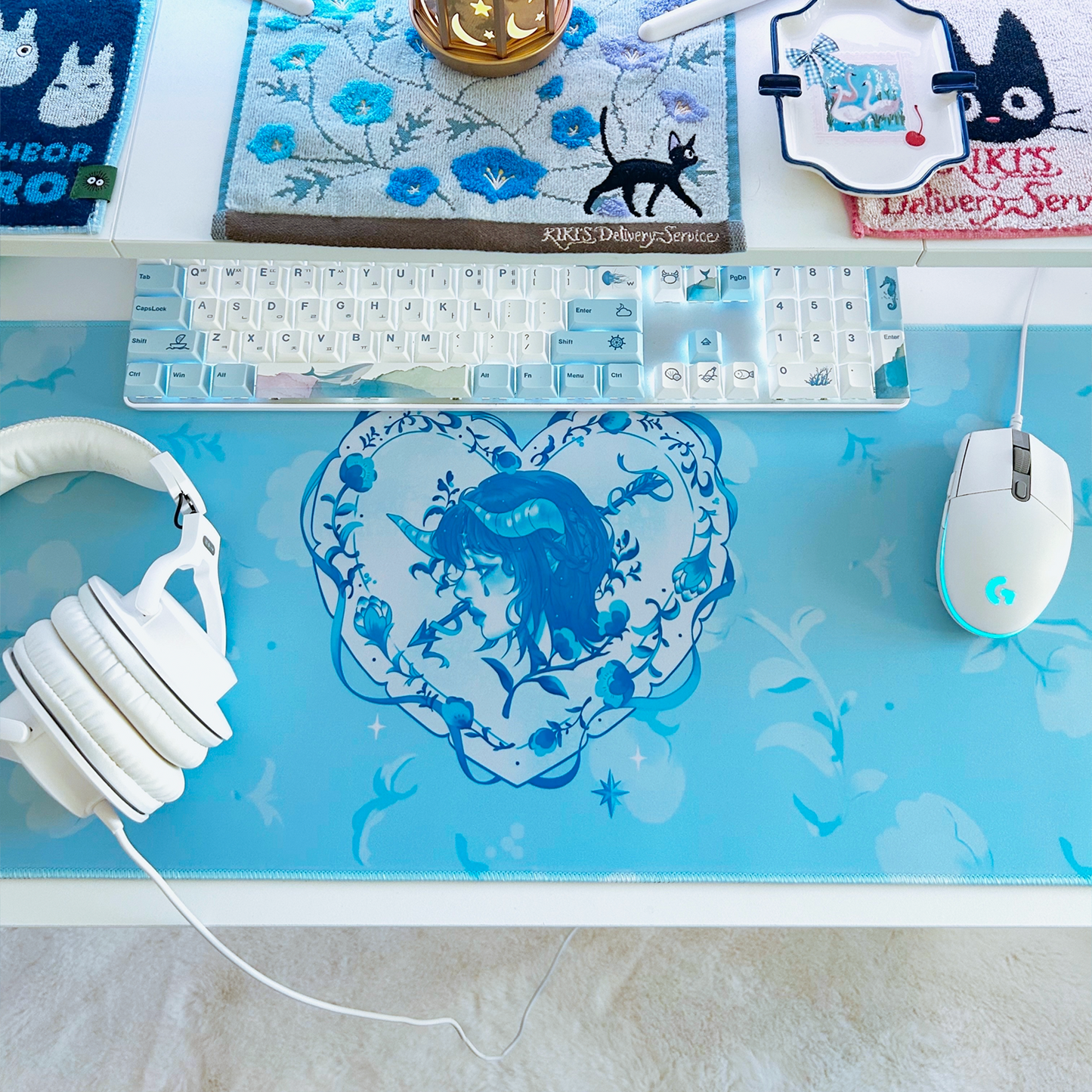 Decorative heart-shaped cupid swan themed mousepad desk mat for cute gaming set-ups and coquette blue and white theme.