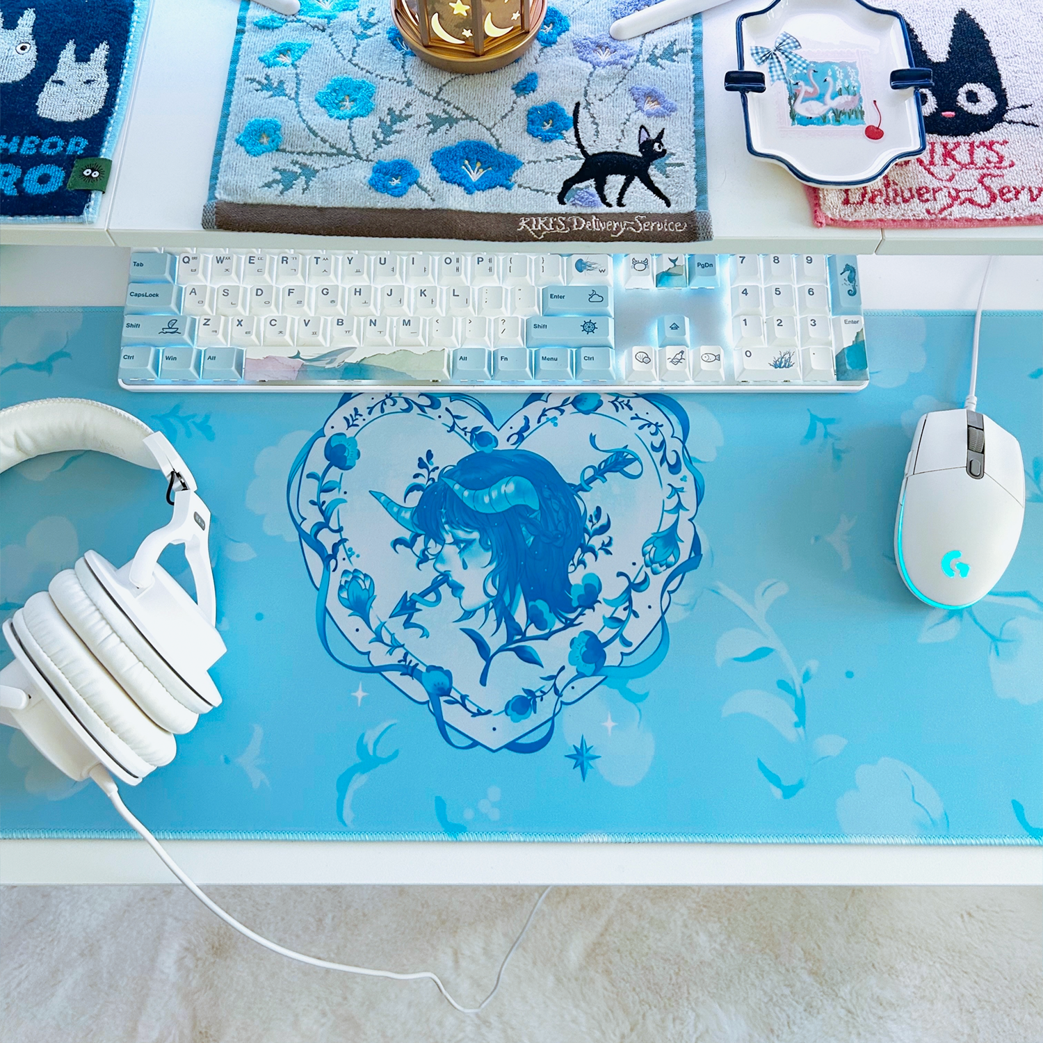 Decorative heart-shaped cupid swan themed mousepad desk mat for cute gaming set-ups and coquette blue and white theme.
