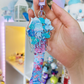 An acrylic lanyard keychain featuring a Jellyfish Garden concept
