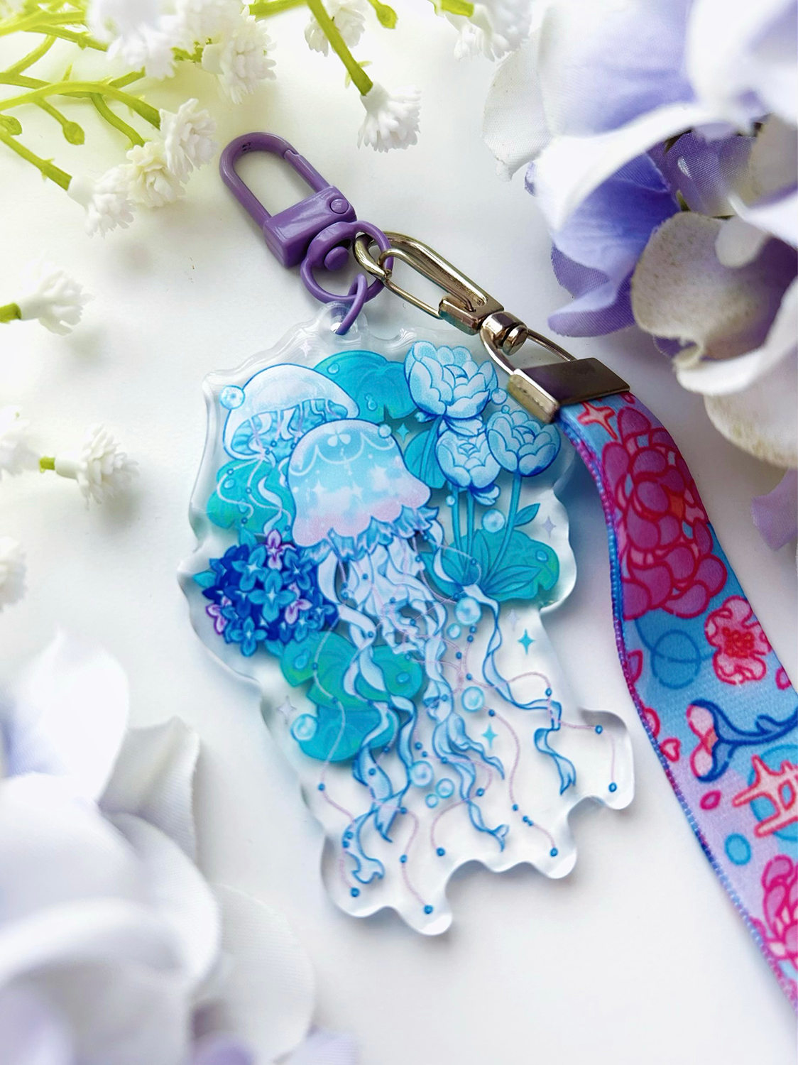 An acrylic lanyard keychain featuring a Jellyfish Garden concept